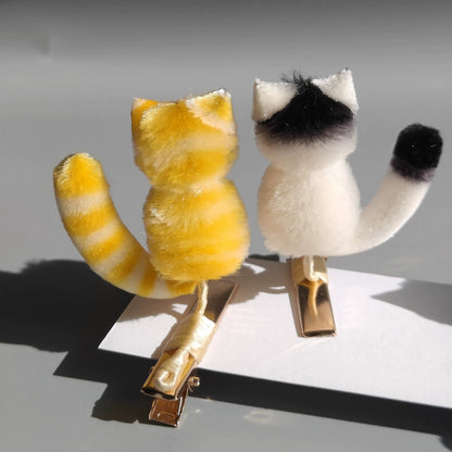 Handmade Ronghua cat hair clips – orange tabby and black-white kitten in mulberry silk velvet