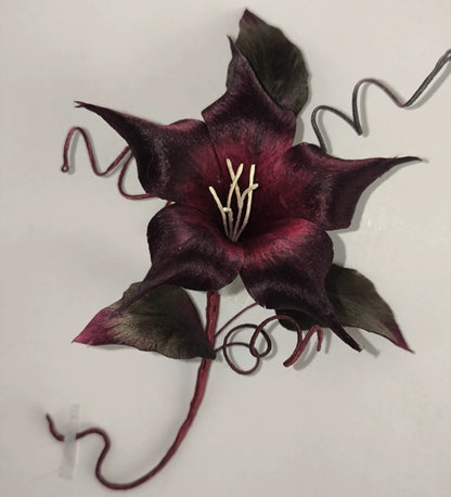 Ronghua oversized black datura brooch worn on dark coat – lightweight silk statement pin for hanfu and formal wear