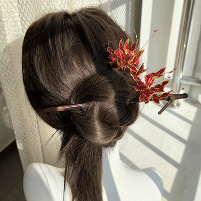 Ronghua flame lily hairpin worn in hair – lightweight dramatic silk floral accessory for hanfu and weddings