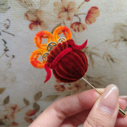 Handmade Ronghua money bag brooch in red velvet – natural mulberry silk Chinese craft with orange loops and silver details