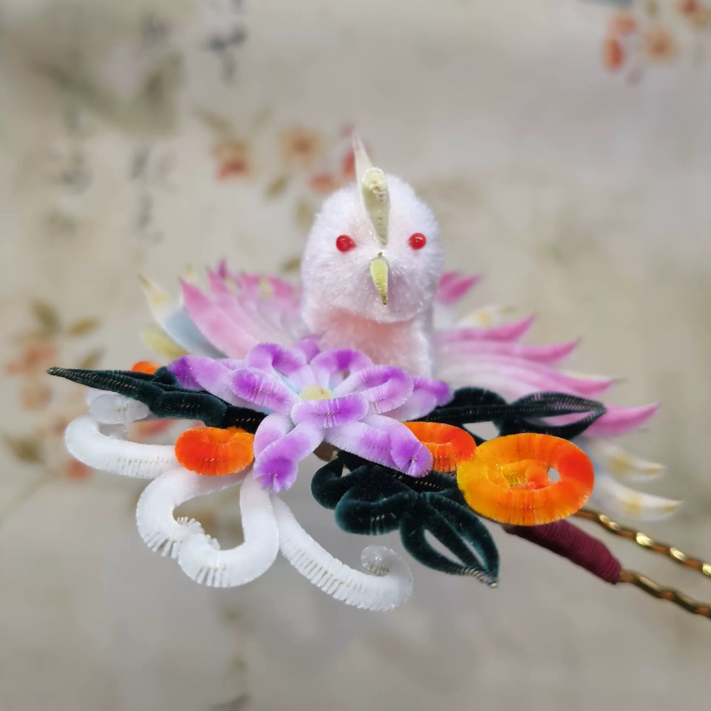 Close-up of Chinese velvet flower phoenix hair pin in pink and purple mulberry silk, handmade Ronghua accessory