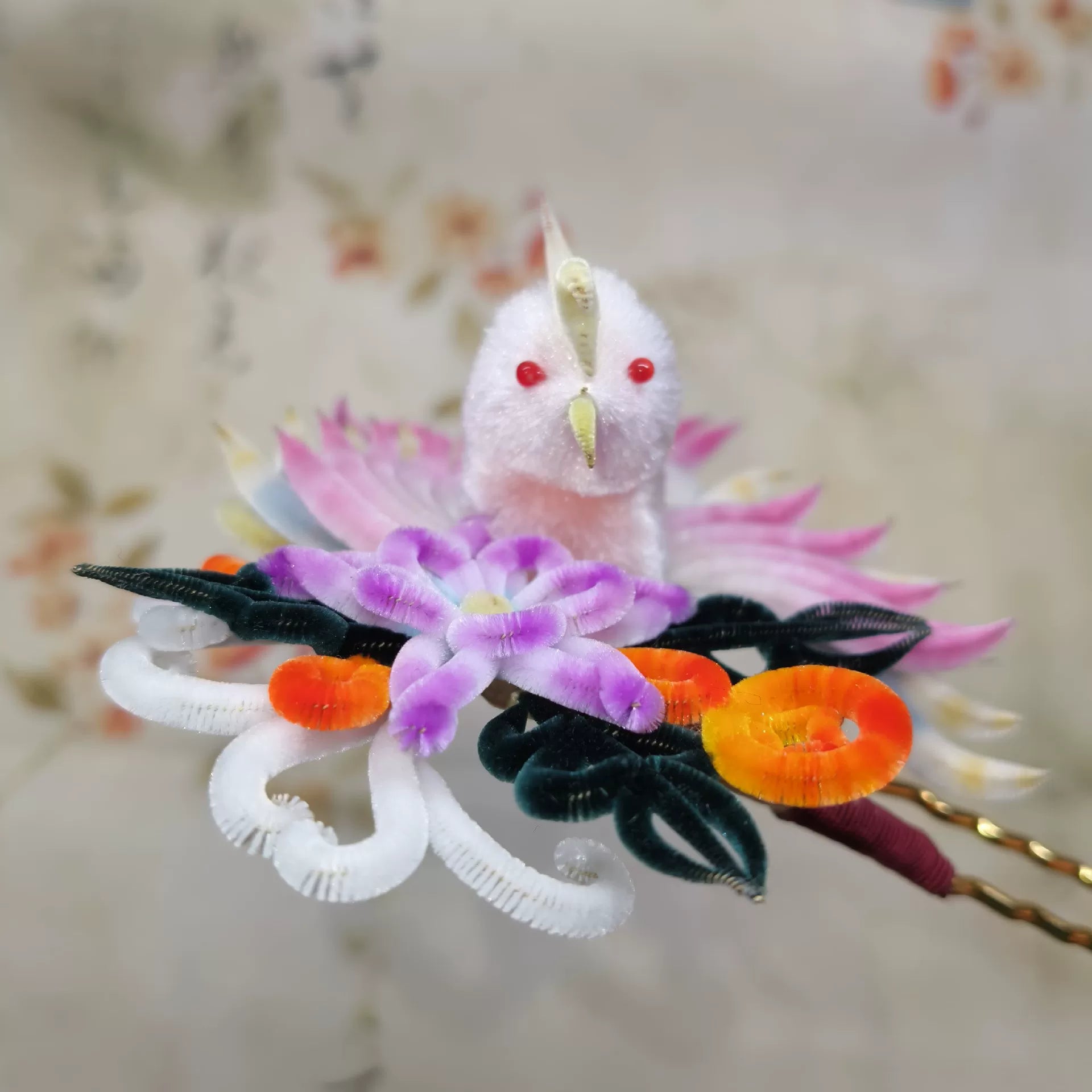 Close-up of Chinese velvet flower phoenix hair pin in pink and purple mulberry silk, handmade Ronghua accessory