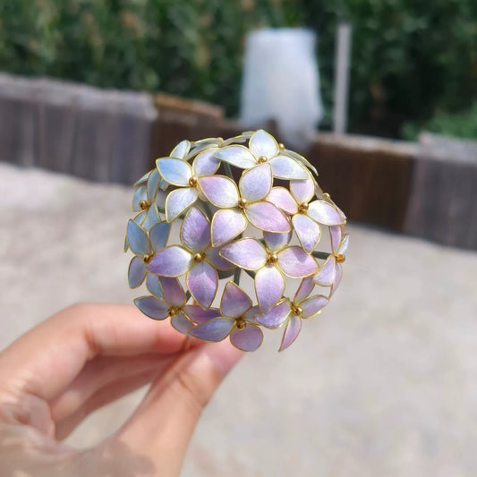 Handmade Ronghua hydrangea ball hairpin in purple mulberry silk velvet flowers on gold pin, outdoor setting